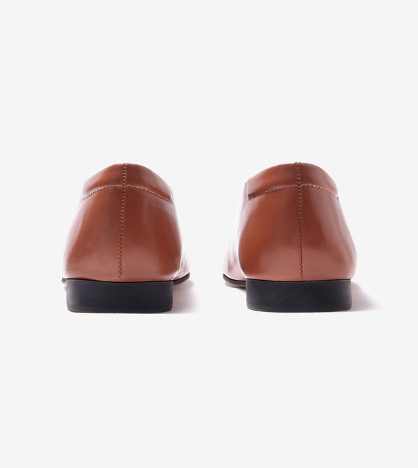 Minimal seam detail slip-on flats for women in tan, pair, back view
