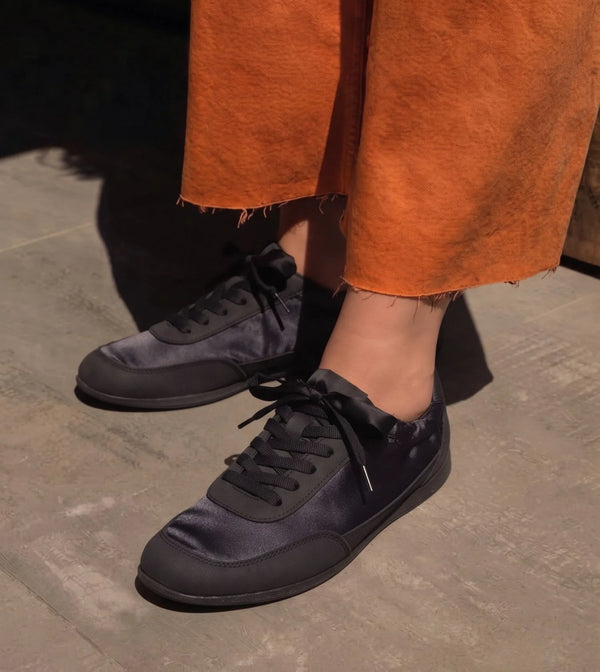 RUSH slim lace-up sneakers for women in onyx black, worn on foot